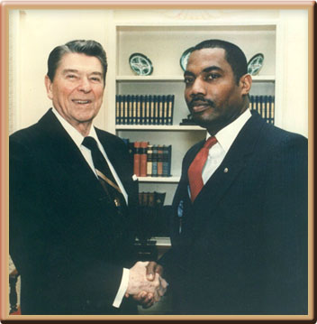 Ronald W. Reagan, President fo the United States and George Hicks, III Master Sergeant, US Army, Oval Office, The White House, 1980s